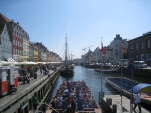 a boat on a canal with people