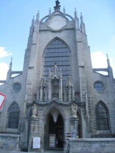 a large stone building with a clock