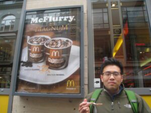 a man standing in front of a sign