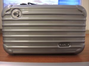 a grey suitcase on a table
