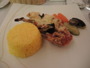 a plate of food with rice and vegetables