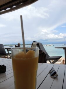 a glass of orange juice on a table