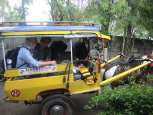 a couple of men in a yellow vehicle