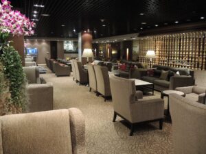 a room with many chairs and tables