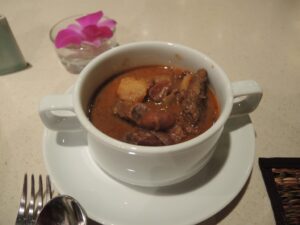 a bowl of soup on a plate