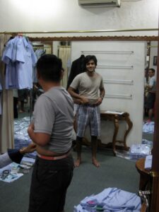 a man standing in front of a mirror