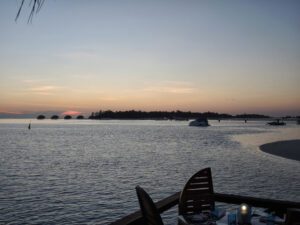 a table and chairs overlooking a body of water
