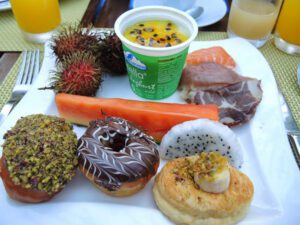 a plate of food and a cup of juice