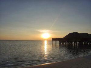 a sunset over a body of water
