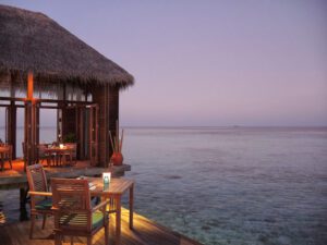 a restaurant on a dock overlooking the ocean