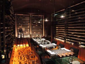 a restaurant with a glass table and chairs
