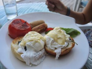 a plate of food with eggs and sausage