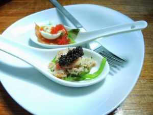 a plate with spoons and food on it