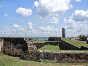 a stone wall with grass and Galle