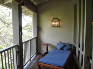 a bed on a porch