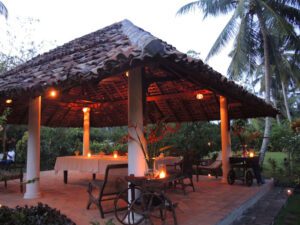 a gazebo with a table and chairs