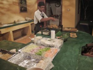 a man preparing food in a kitchen