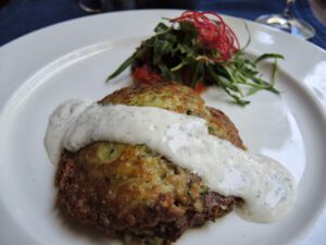 a plate of food with a white sauce