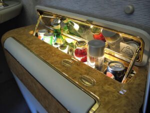 a small beverage cabinet with drinks inside
