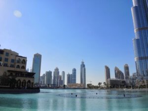 a city skyline with a body of water