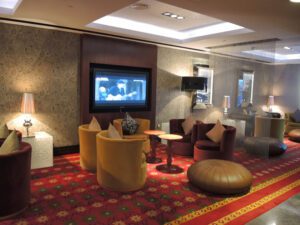 a room with a television and chairs