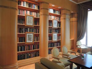 a room with a bookcase and a table