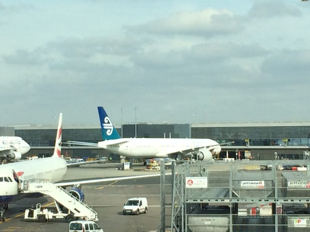 a group of airplanes at an airport