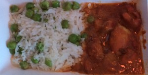 a plate of rice and peas