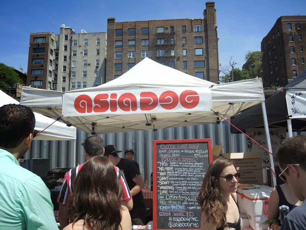 a group of people standing under a tent