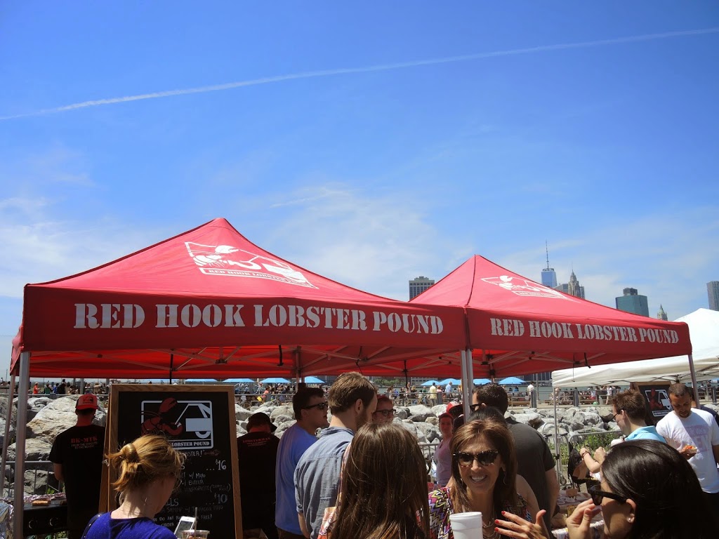 a group of people standing under a tent
