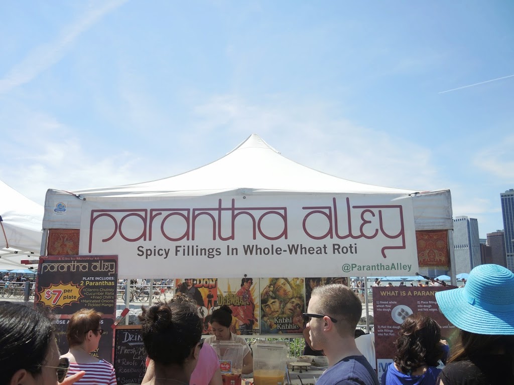 a group of people standing in front of a tent