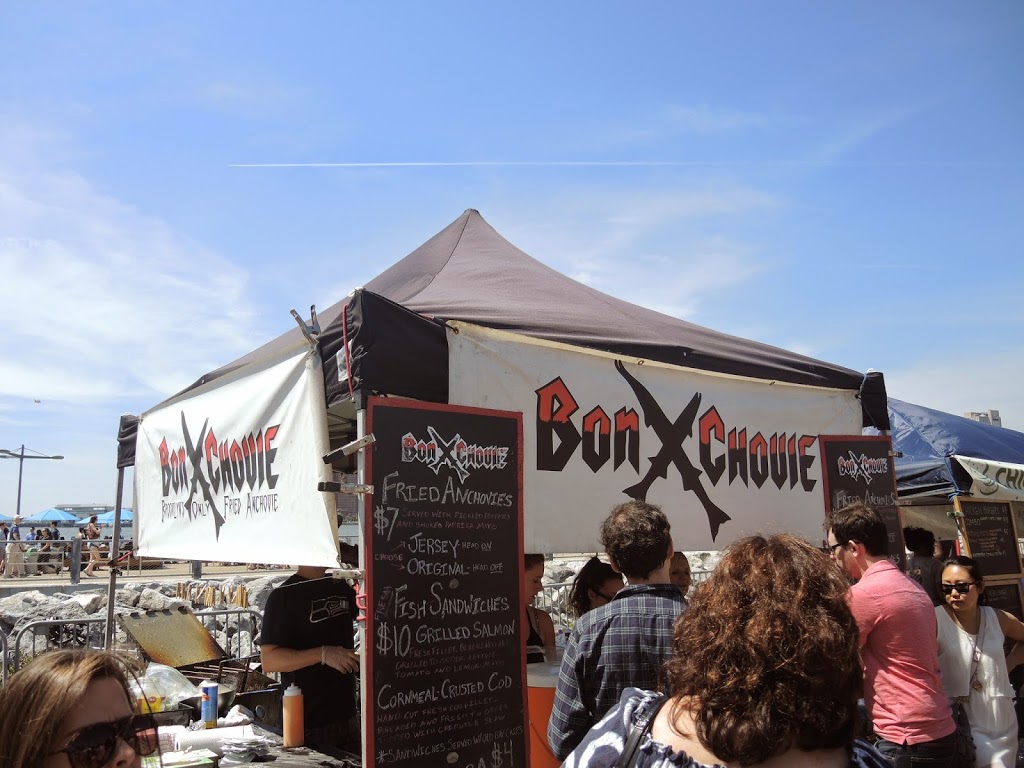 a group of people standing in front of a tent