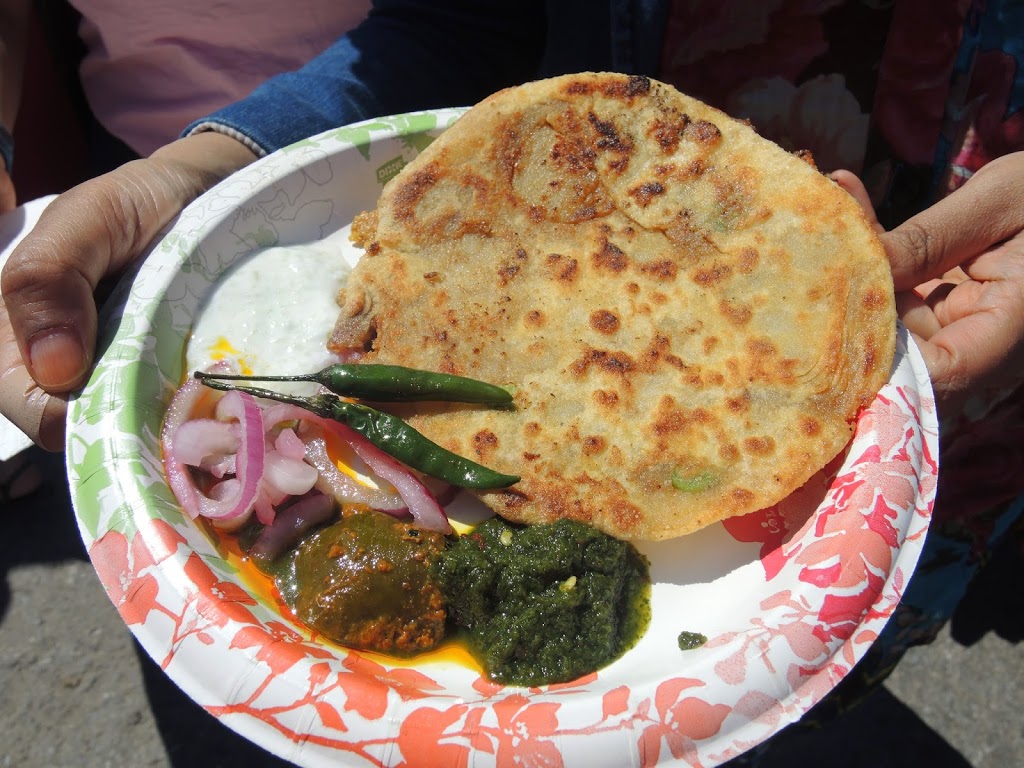 a plate of food with a person holding it