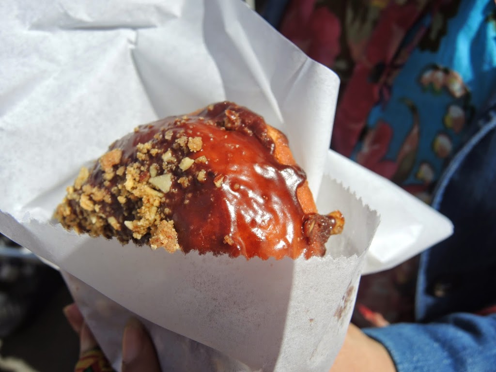 a hand holding a pastry