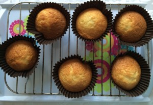 a group of cupcakes on a cooling rack