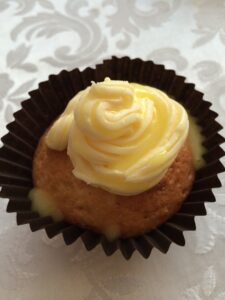 a cupcake with yellow frosting