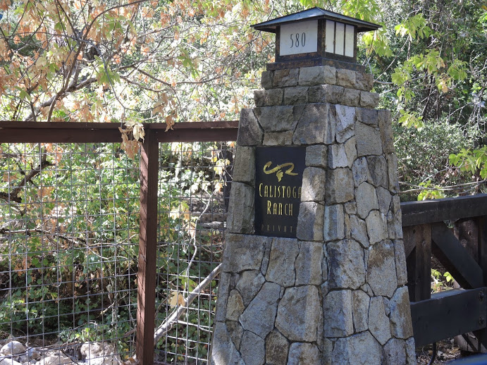 a stone pillar with a light on it