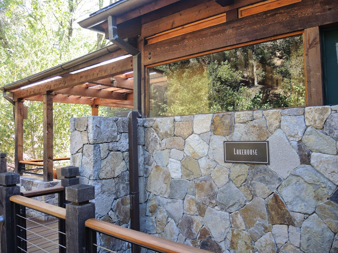 a stone wall with a sign on it
