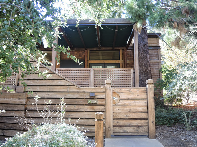 a wooden house with a porch and a porch