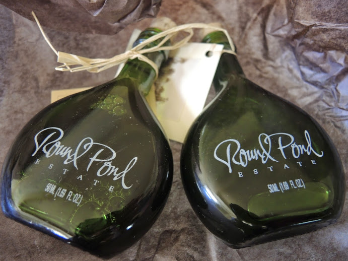 two bottles of alcohol on a brown surface