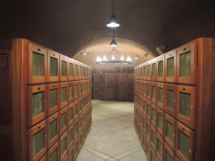 a room with wooden cabinets and a ceiling light