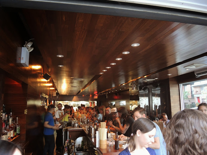 a group of people in a bar