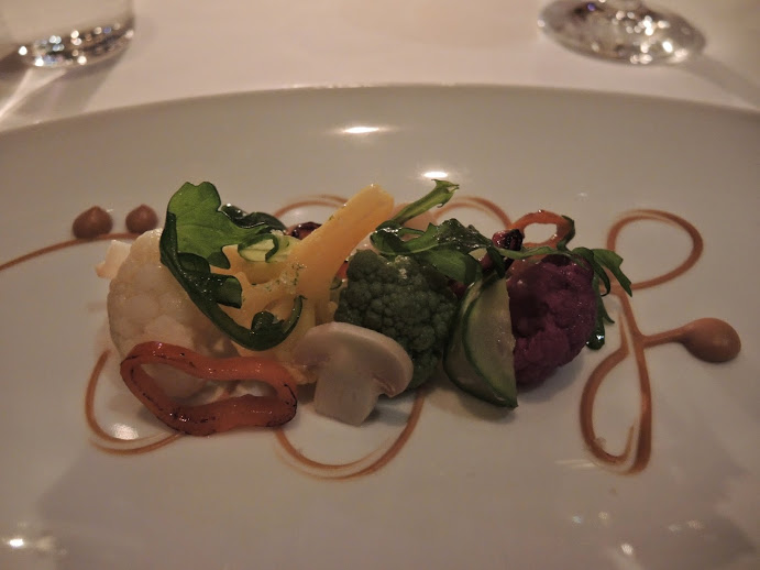 a plate of vegetables on a table