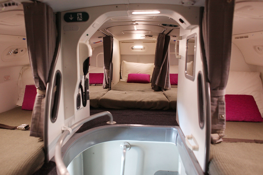 a room with a bed and a bathtub