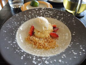 a plate of food with a scoop of ice cream on top