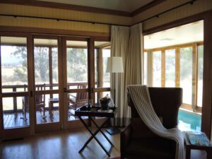 a room with a pool and a chair