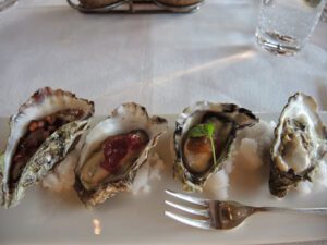 a plate of oysters on a table