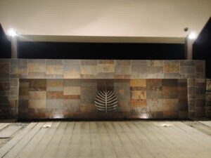 a wall with a metal object on it