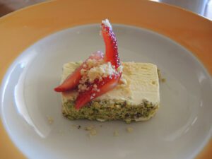 a piece of cake with strawberries on top