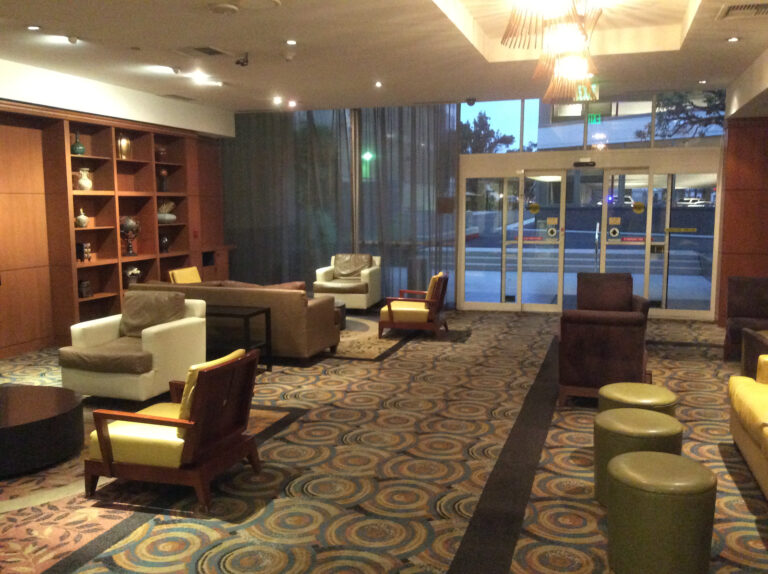 a room with chairs and a bookcase